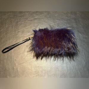 Luxurious Faux Fur Wristlet with gold hardware.